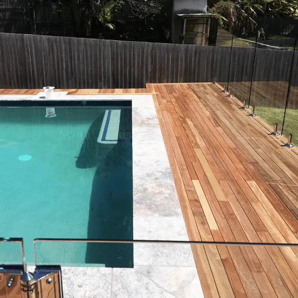 Timber pool deck with a glass pool fence