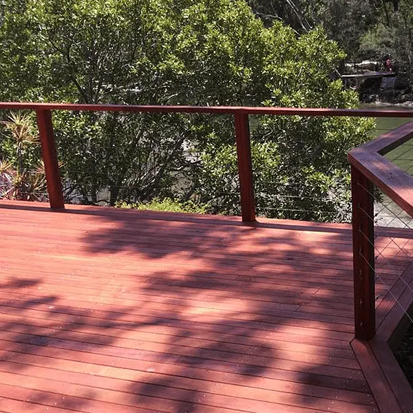 Red timber deck with timber and wire railing
